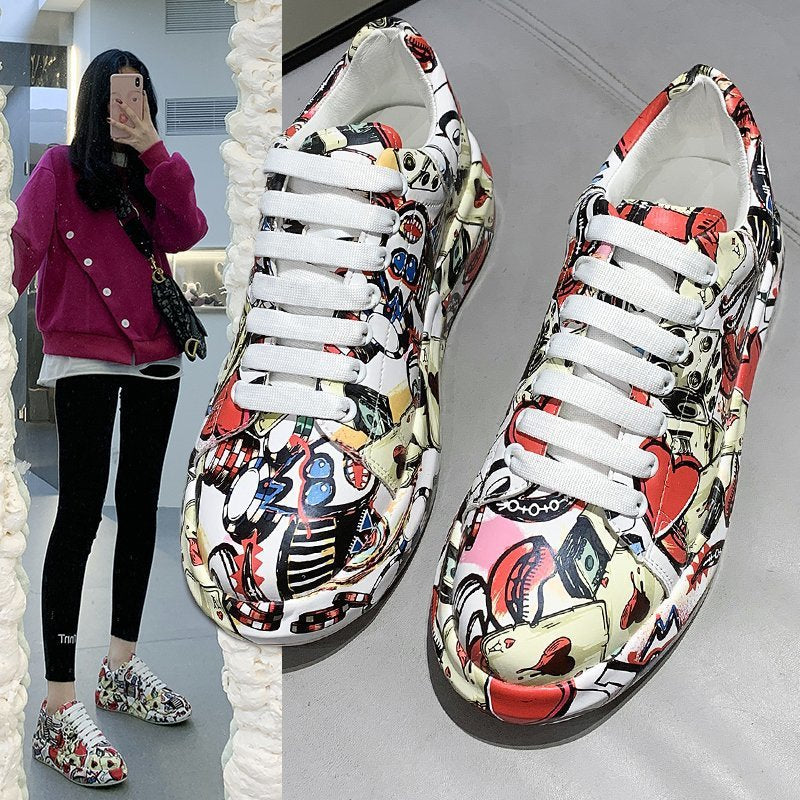 Colorful patterned sneakers with white laces on a reflective surface.