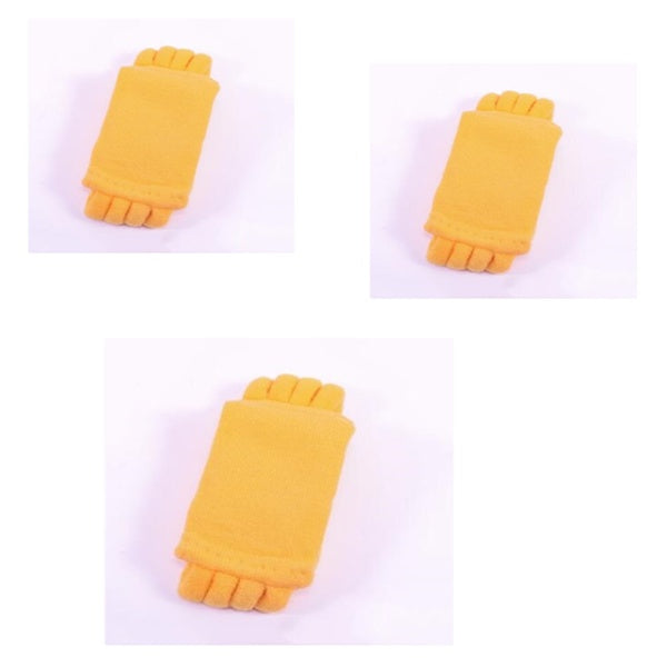 Three yellow hair clips on a white background