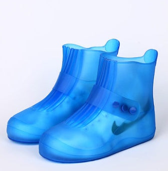 Blue rain boots on a white background