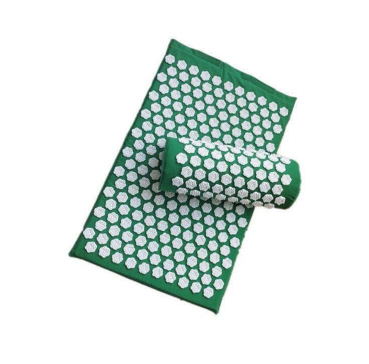 Green acupressure mat with white dots on a white background