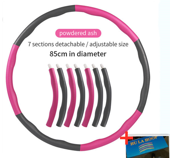 Pink and black hula hoop with detachable sections on a white background, featuring Hula Hoop brand logo.
