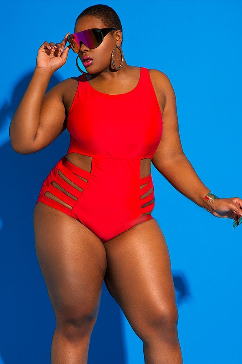 Woman wearing a red swimsuit against a blue background