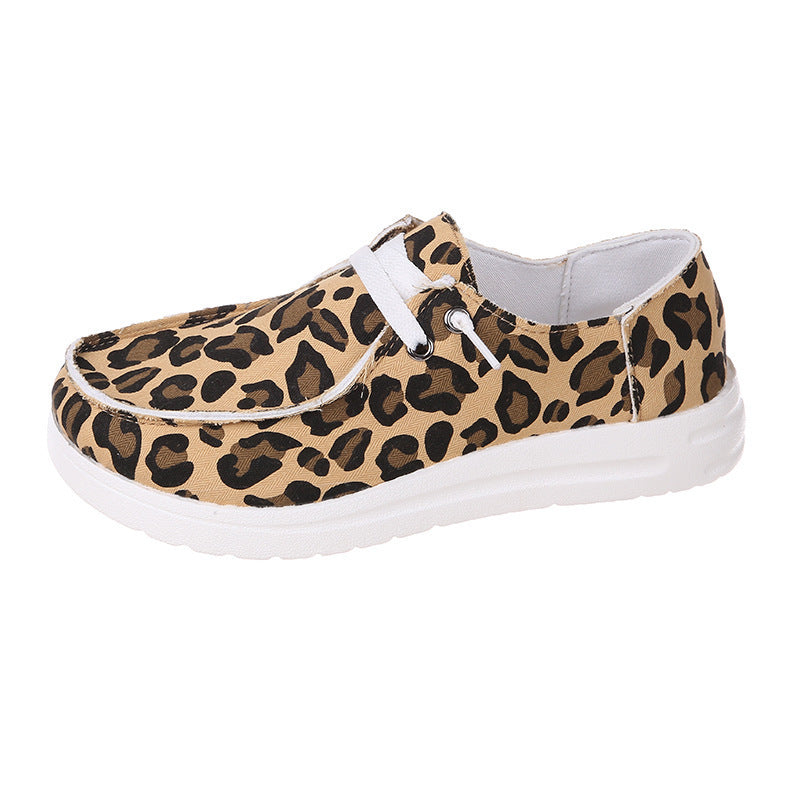 Leopard print sneaker with white sole on a white background