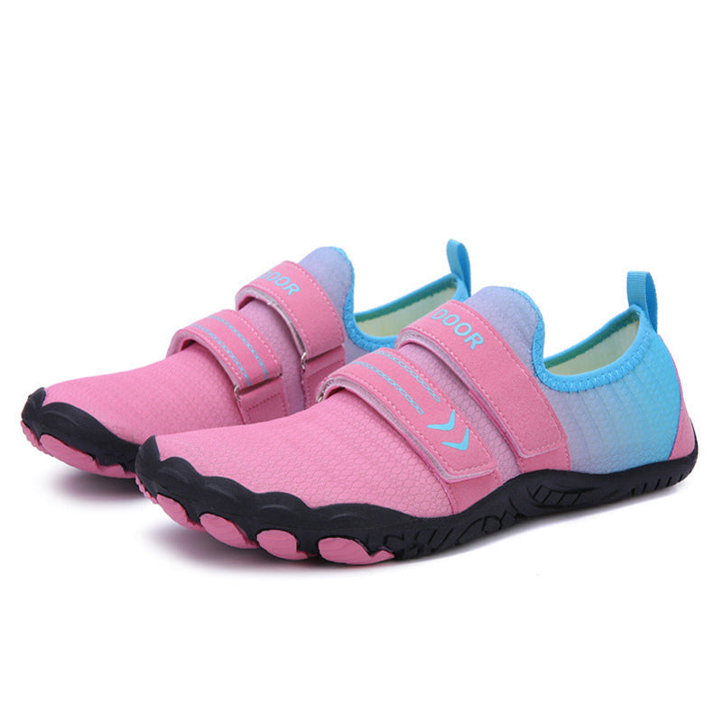 Pink and blue children's water shoes with velcro straps on a white background