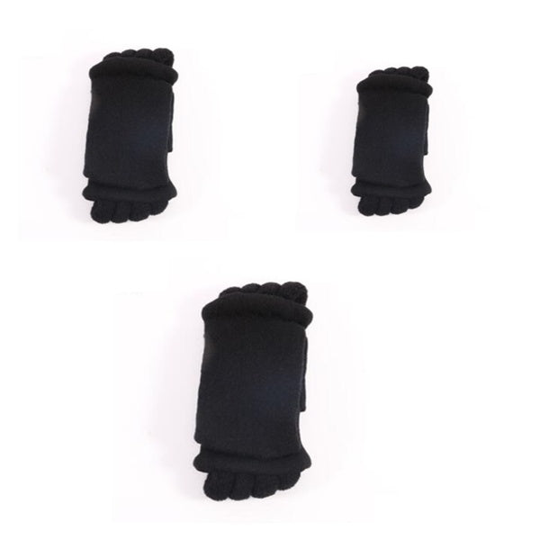 Three pairs of black baby socks with toes on a white background