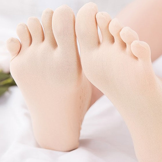 Beige toe-separated socks on a white background