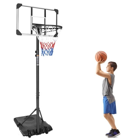 Child playing basketball with a portable hoop on a white background