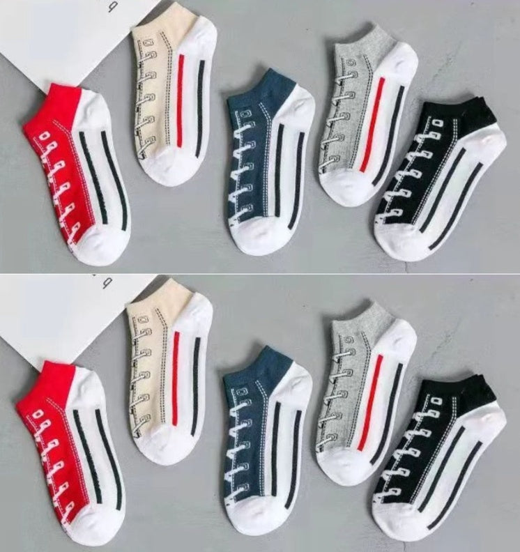 Set of six pairs of socks with shoe lace design on a gray background