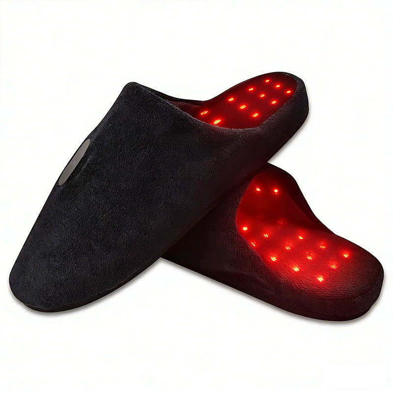 Black slippers with red LED lights on a white background