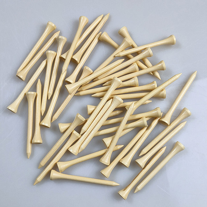 Pile of wooden golf tees on a gray background