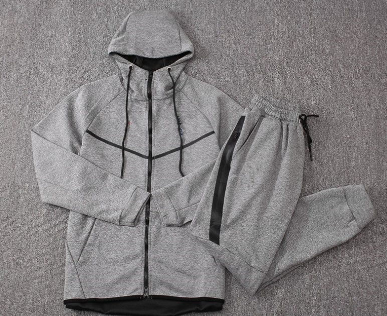 Gray tracksuit with a hood on a gray background