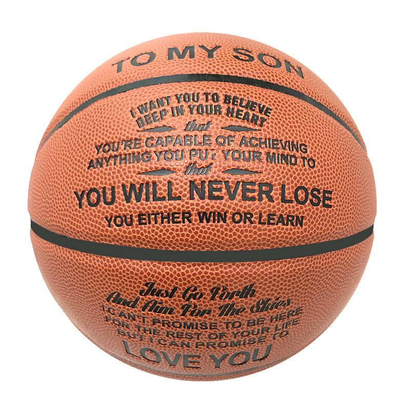 An orange basketball with black printed text that reads 'TO MY SON' and motivational quotes, shown on a plain white background.