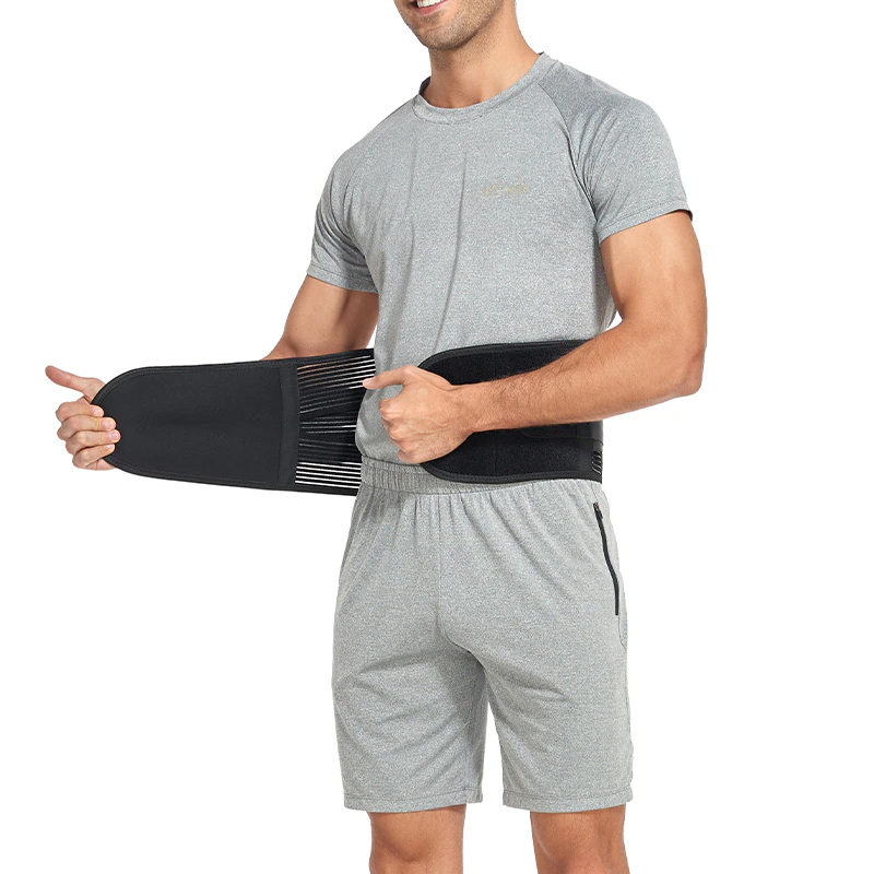 Man wearing a black waist support belt on a white background