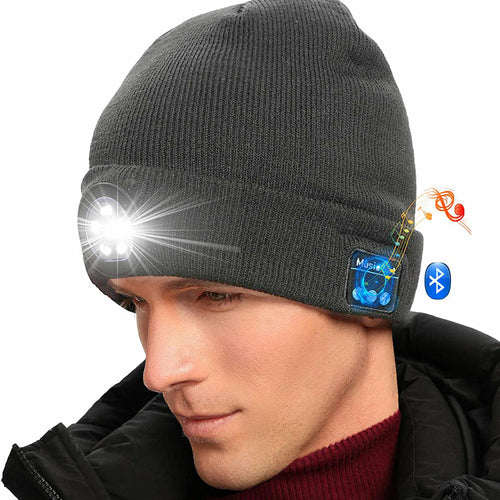 Gray beanie with built-in flashlight and Bluetooth speaker on a white background