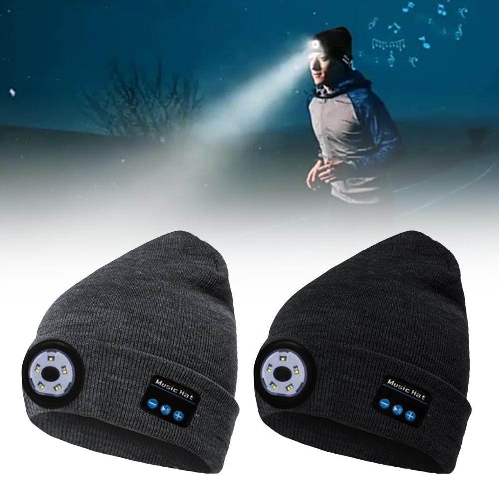 Two beanies with LED lights and Bluetooth speakers on a white background.