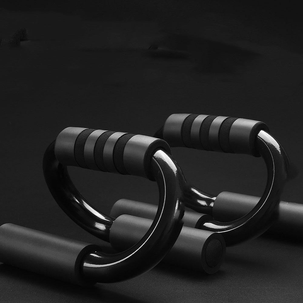 Black push-up bars on a dark background