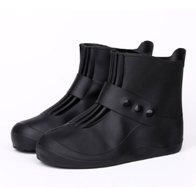 Black rubber shoe covers on a white background