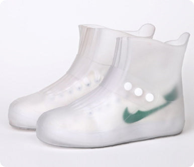 Clear rain boots with a green logo on a white background