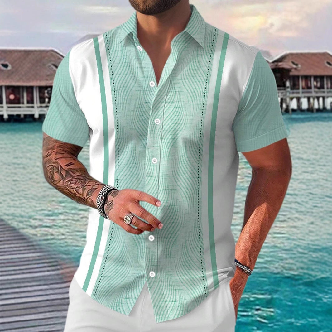 Man wearing a light green and white patterned shirt with a waterfront background