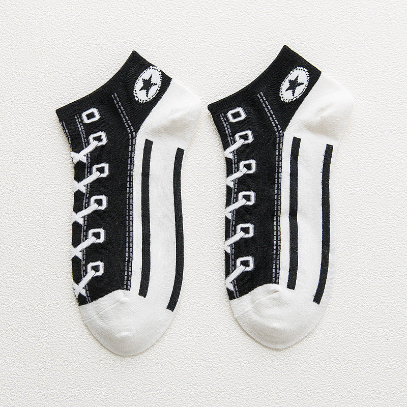 Pair of black and white socks with shoe lace design on a white background