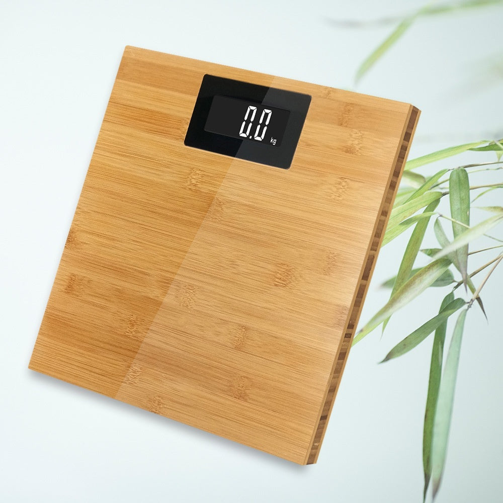 Wooden digital scale with a digital display on a light background