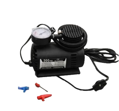 Car air compressor with gauge and accessories on a white background