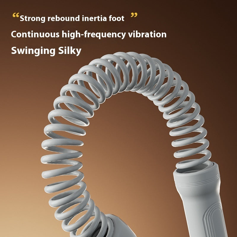 Gray spring-like device with text on a brown background