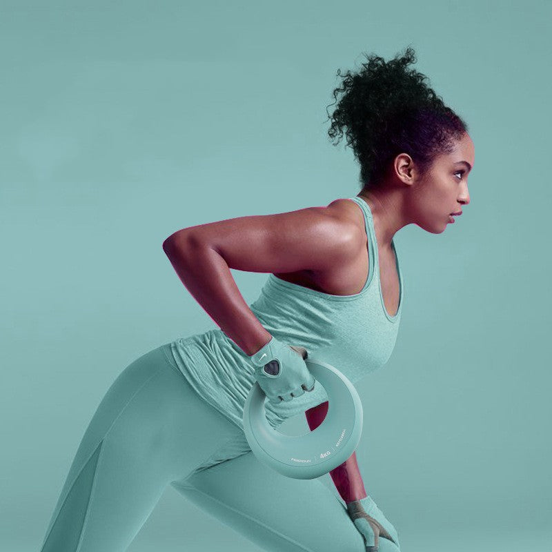 Woman in light blue athletic wear holding a white dumbbell against a light green background