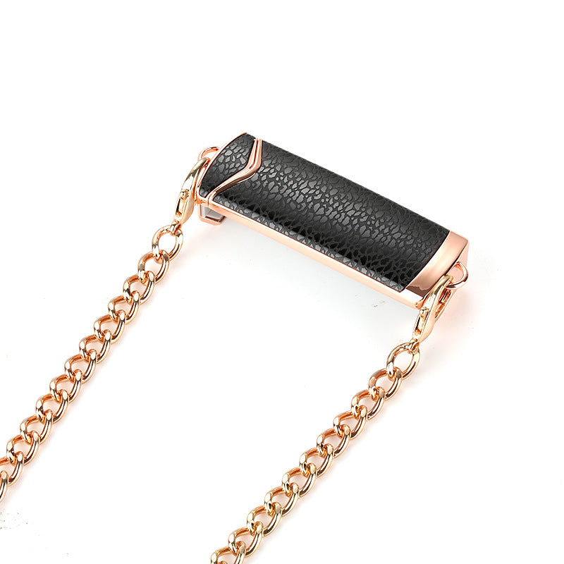 Black leather and rose gold chain bracelet on a white background