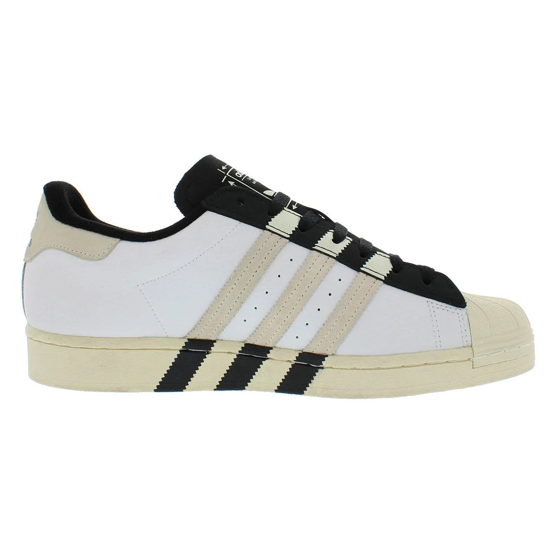 White and beige Adidas Superstar sneaker with black stripes on a white background