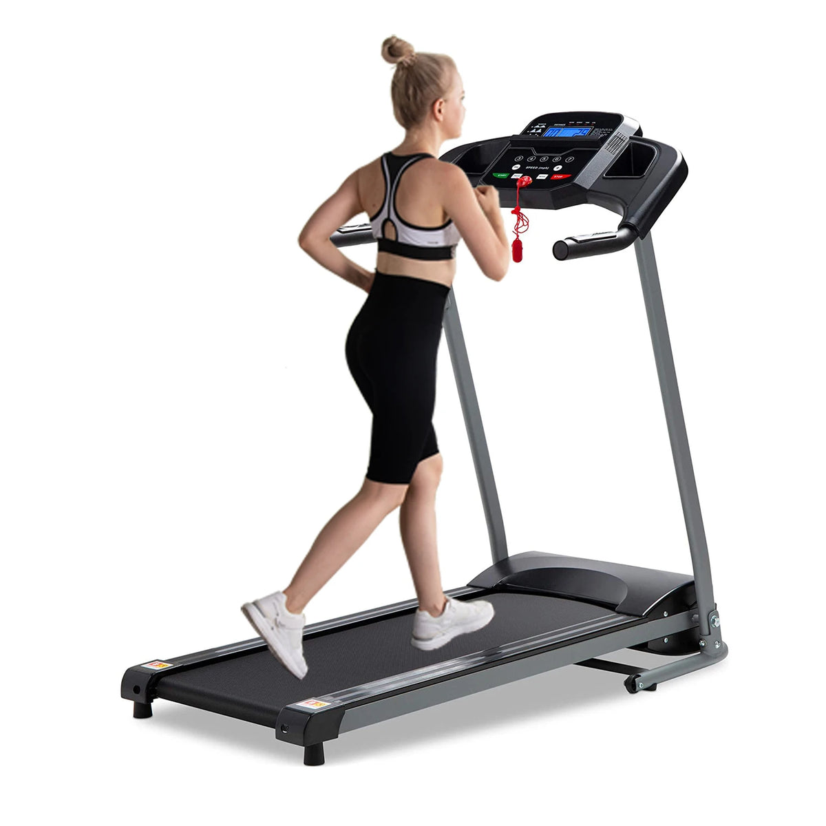 Rear three-quarter view of a woman using a black treadmill with a digital console and red safety-key cord.