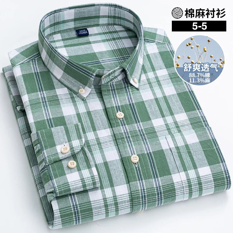 Folded green and white checkered shirt on a white background