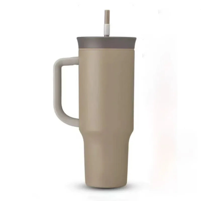 Taupe travel tumbler with gray handle, dark lid and straw on a white background.