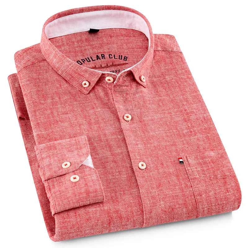 Folded red shirt with 'Opular Club' branding on a white background