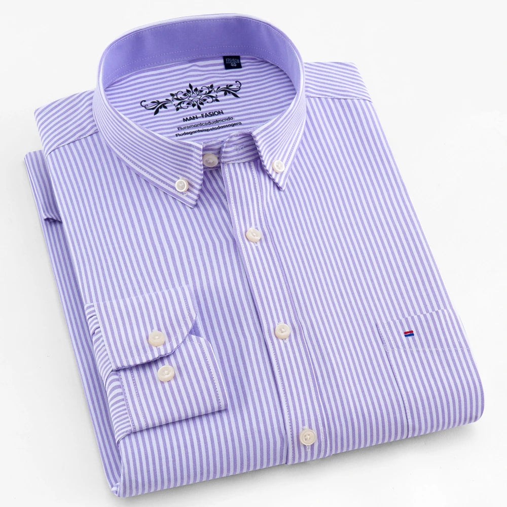 Folded purple and white striped dress shirt on a white background