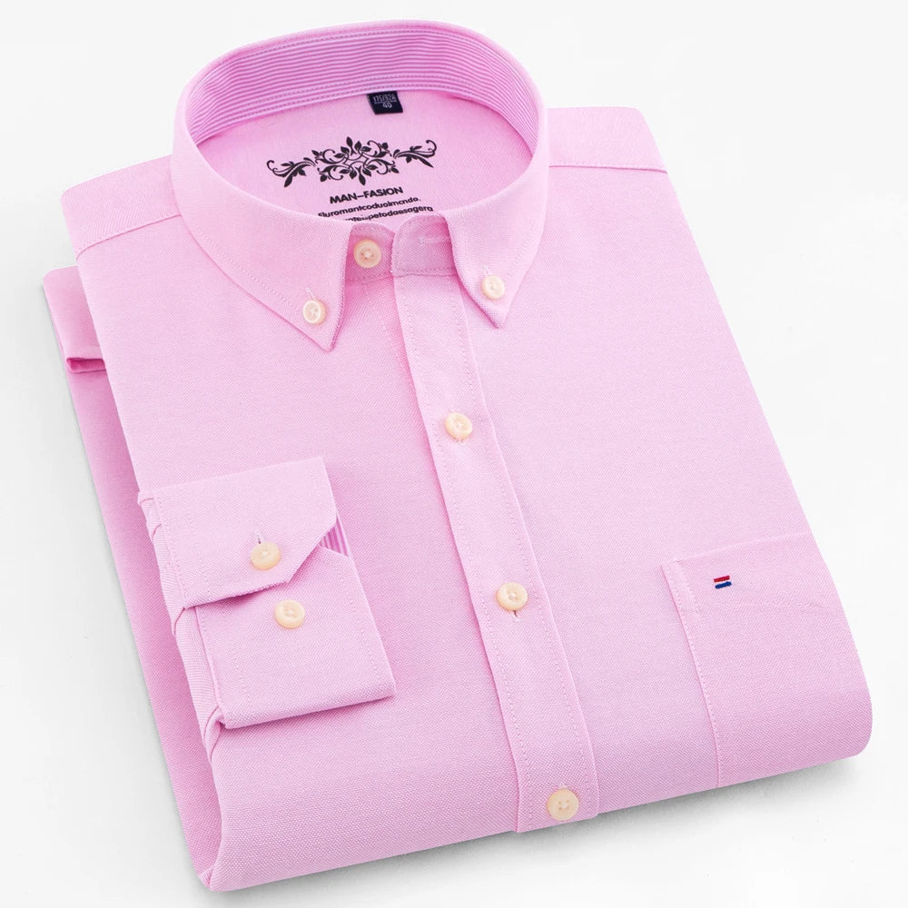Pink dress shirt with brand logo on a light gray background