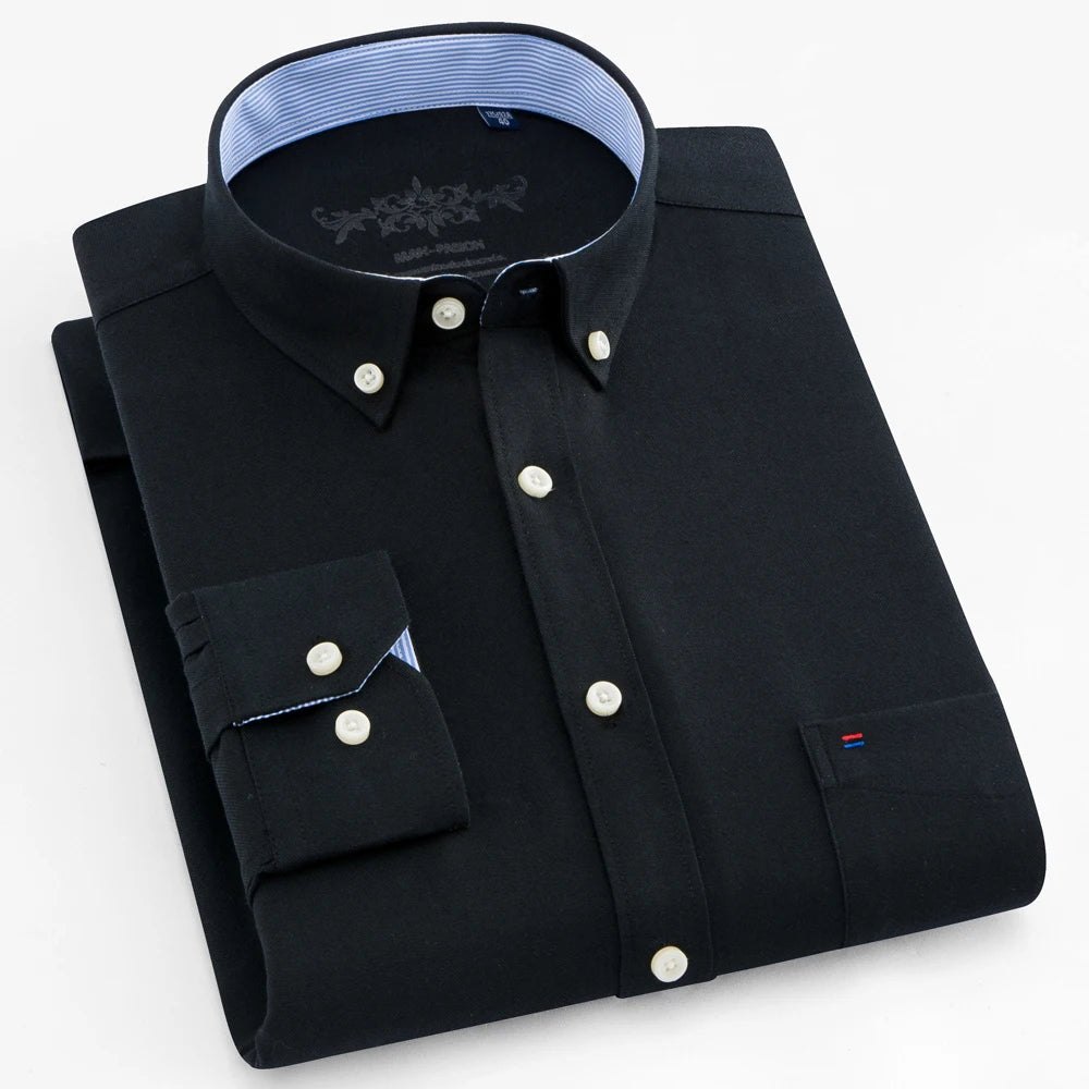 Black dress shirt with white buttons on a light gray background