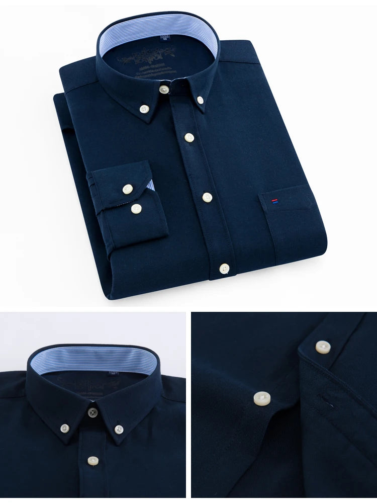 Navy blue dress shirt with white buttons on a white background