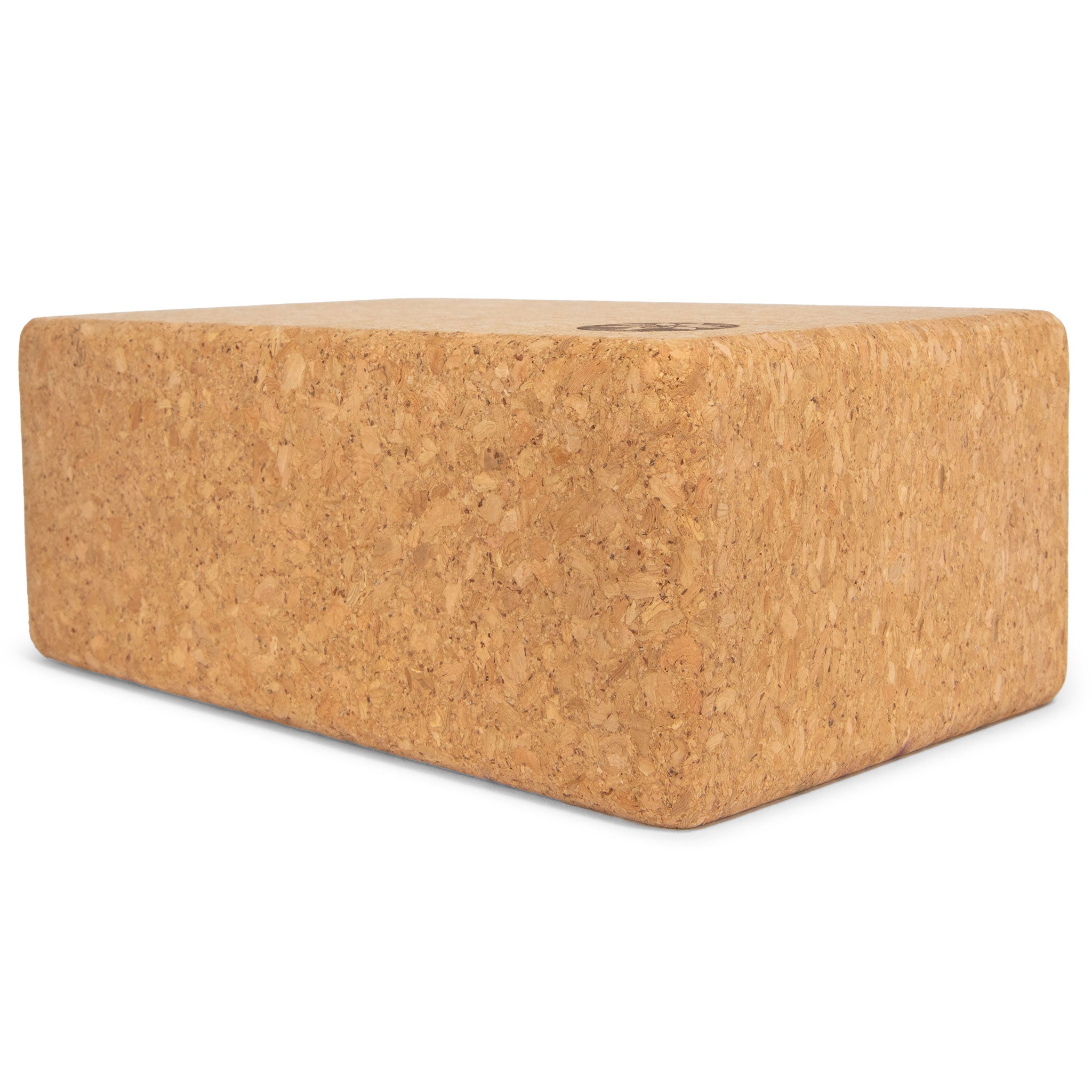 Cork yoga block on a white background