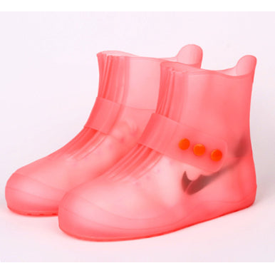 Pink rain boots with a white background