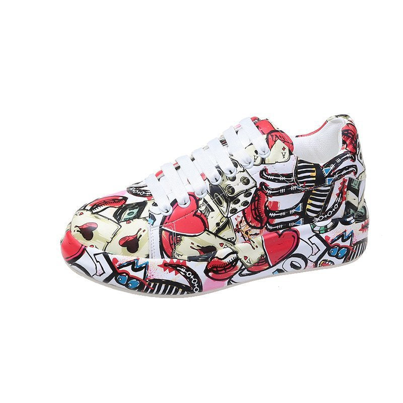 Sneaker with colorful tattoo-style design on a white background