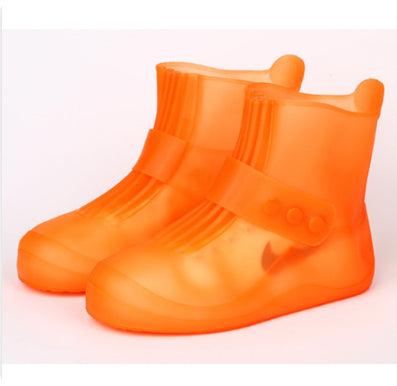 Orange rain boots on a white background