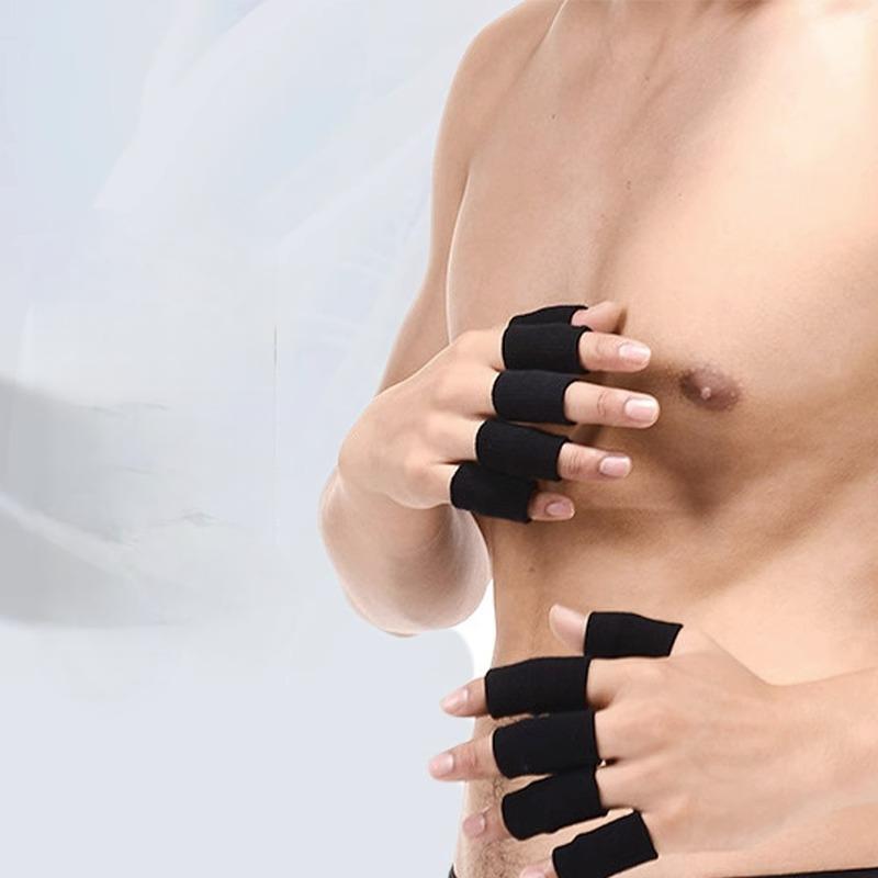 Person wearing black fingerless gloves on a plain background