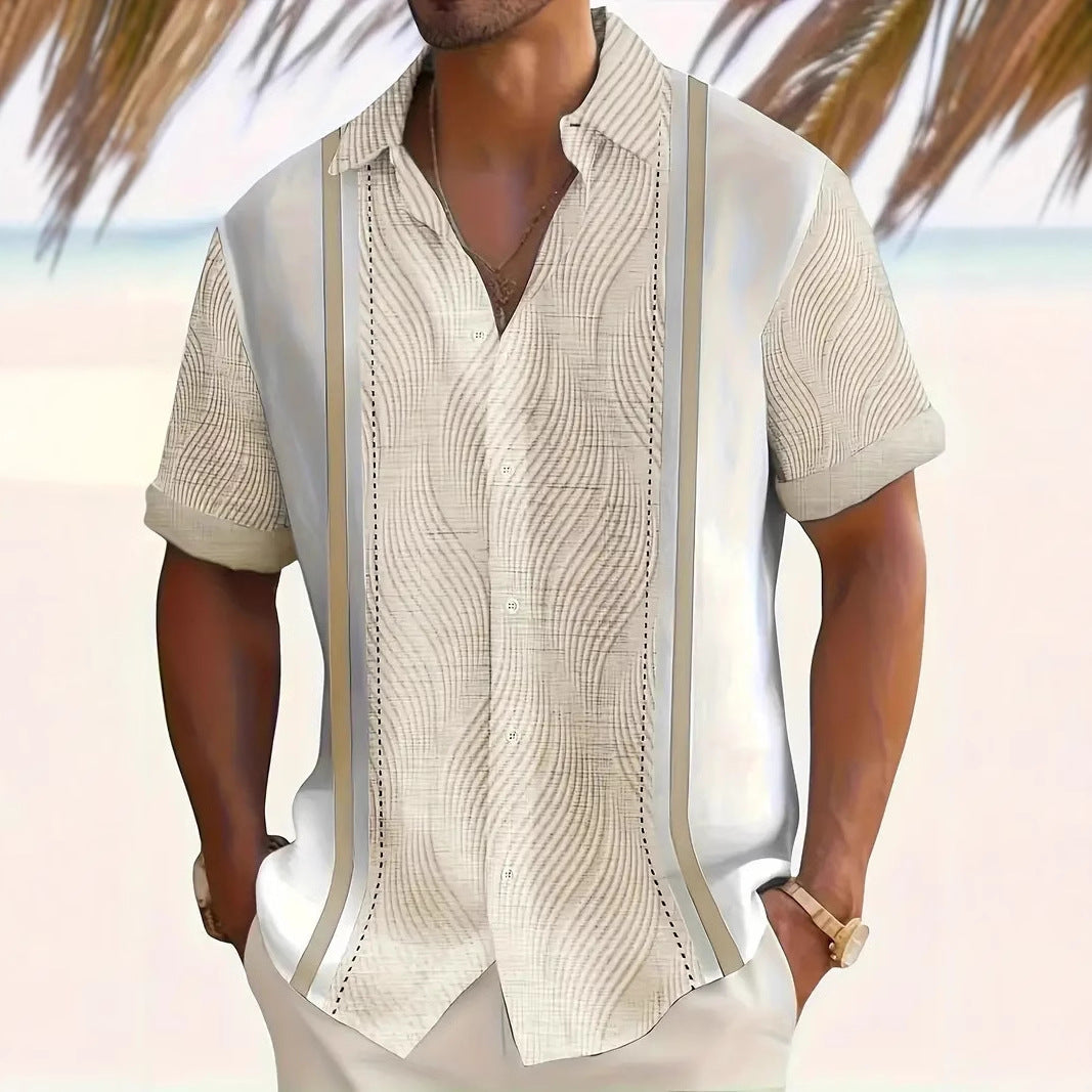 Man wearing a beige patterned shirt with a blurred beach background