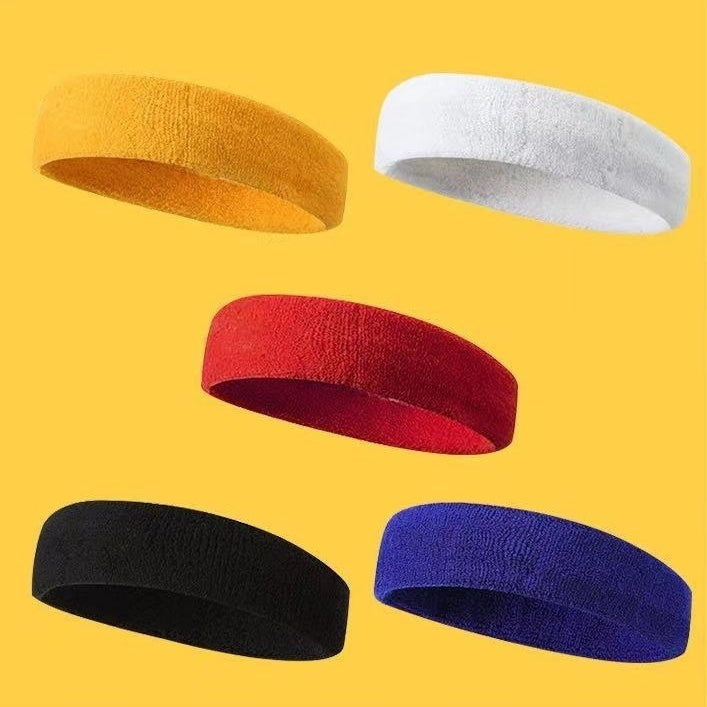 Five colorful headbands (yellow, white, red, black, blue) on a yellow background