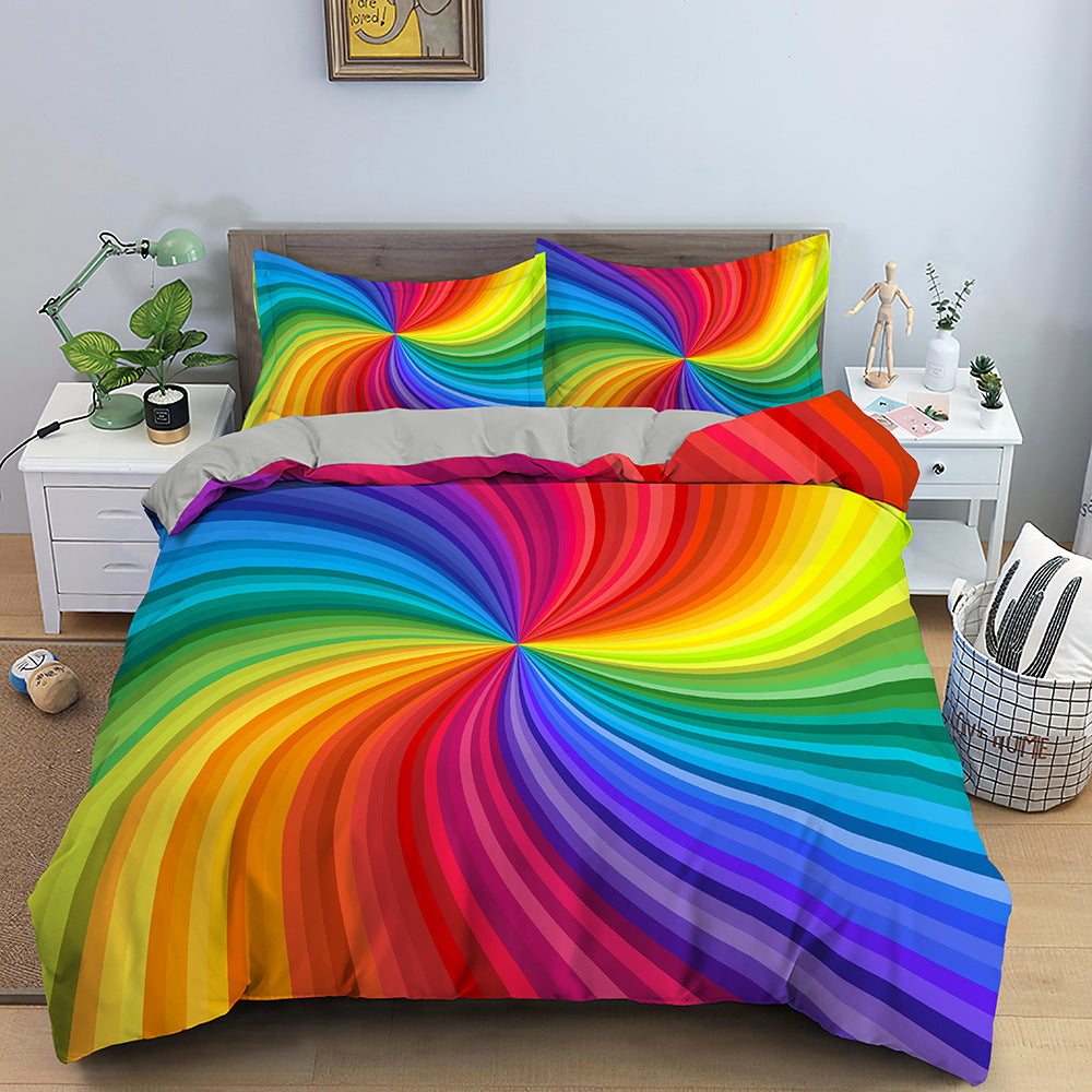 Colorful spiral patterned bedding set on a bed in a bedroom.