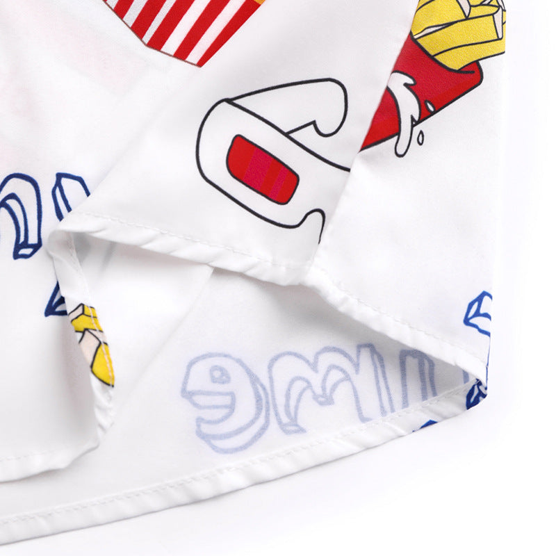 Close-up of a white fabric with colorful cartoon character designs on a white background