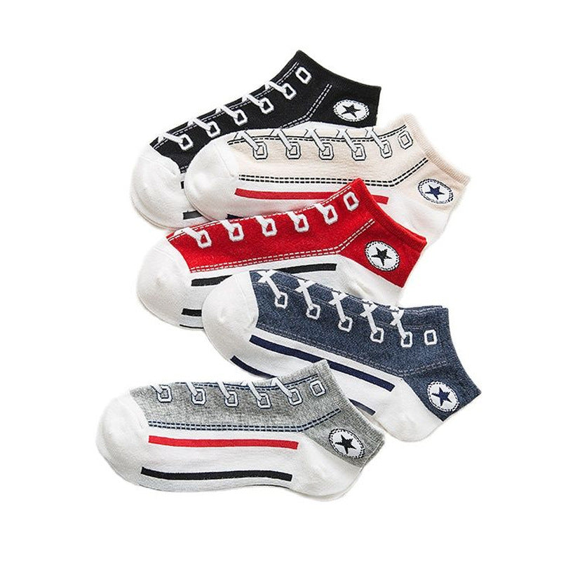 Set of five baby socks with shoe design and Converse logo on a white background