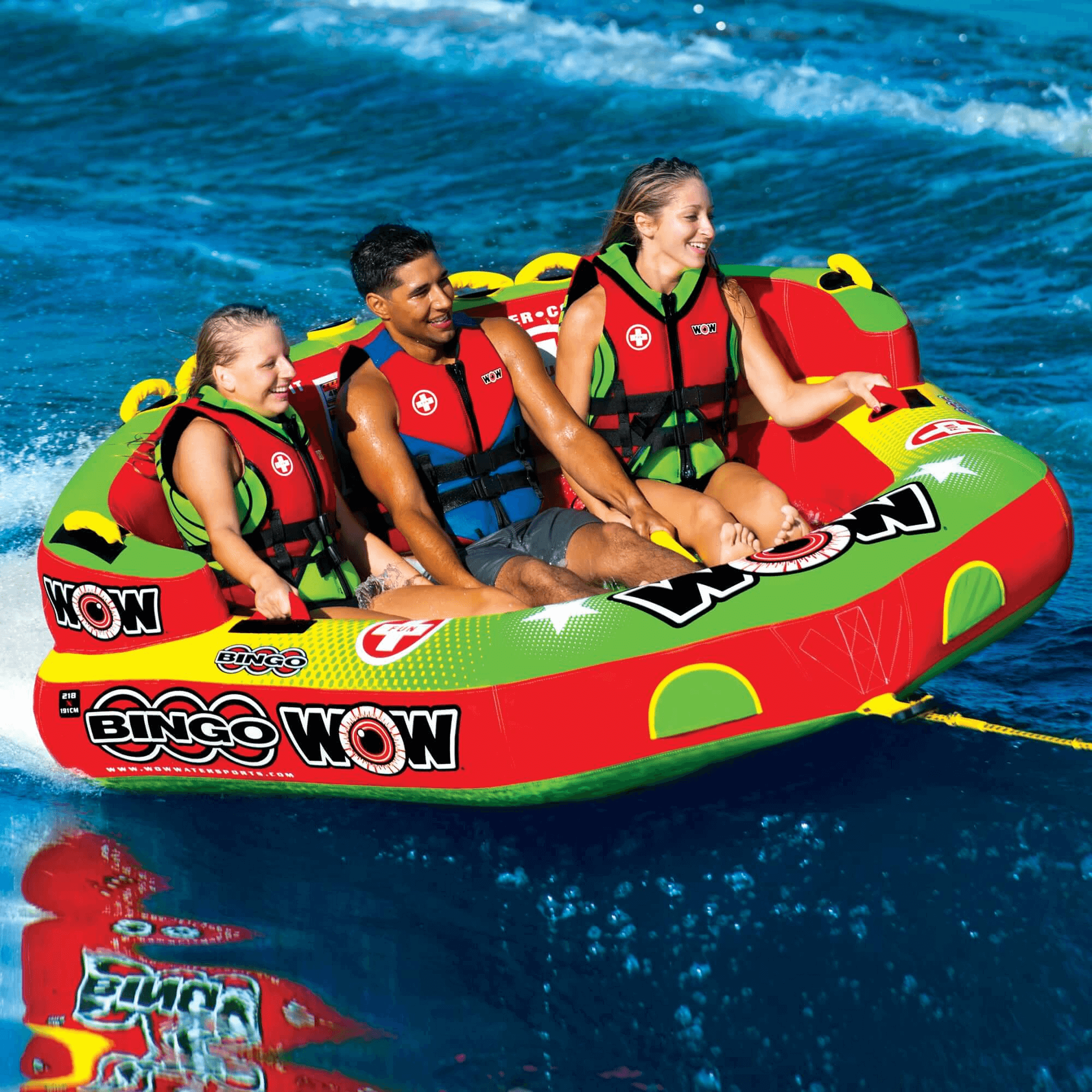 Three people on a colorful inflatable tube in the water with 'Bing Wow' branding.