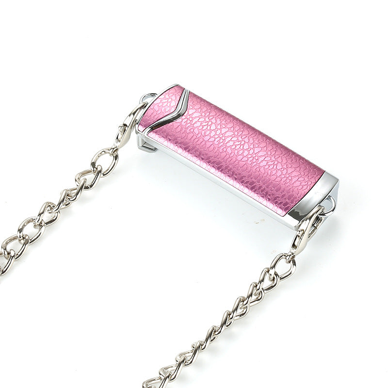 Pink cylindrical object with silver chain on a white background